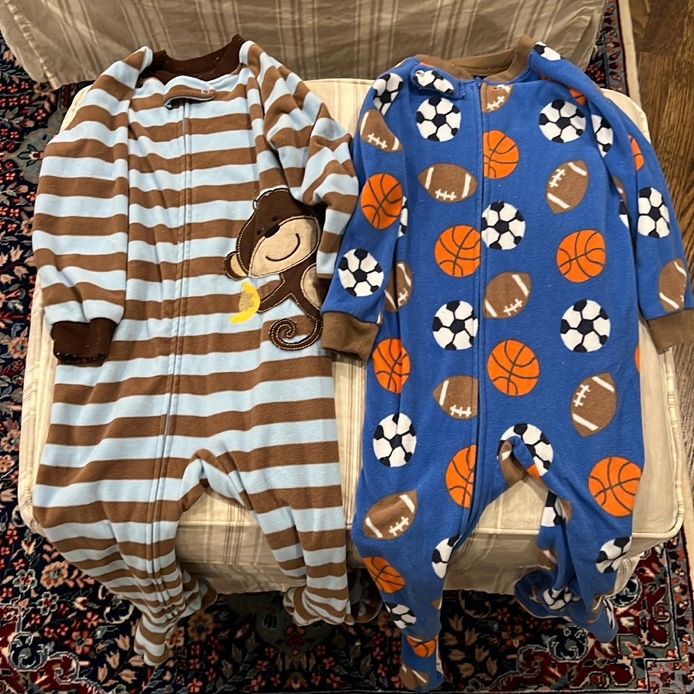 Two - size 24 month Carter’s fleece footed pajamas